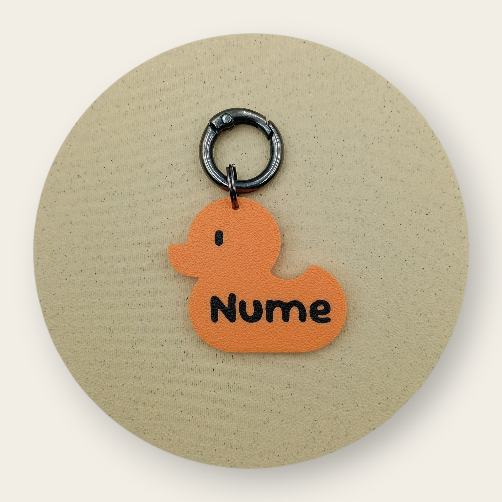 Medalion personalizat pentru câini, formă de rățușcă, portocaliu cu negru, printat 3D din PLA - Ubba.